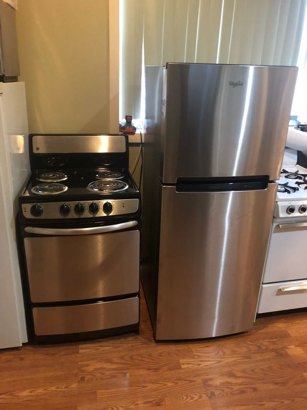 Whirlpool 24 inch wide refrigerator and GE 24 inch wide stove electric
