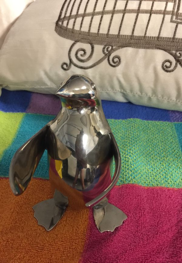 Restoration Hardware silver penguin statue. May be wine bottle holder