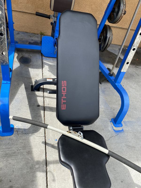 Olympic squat rack with ethos bench for Sale in Los