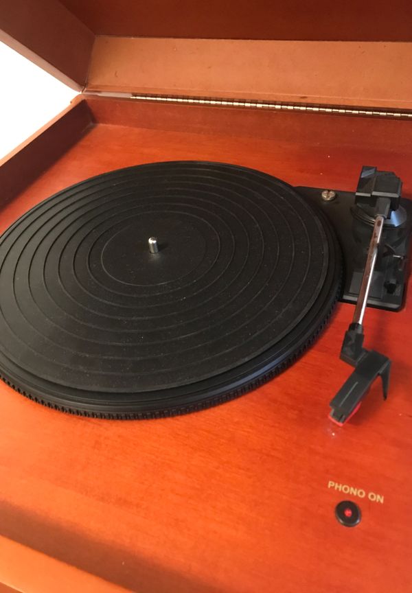 Standing Crosby record player, radio, CD player, and cassette player