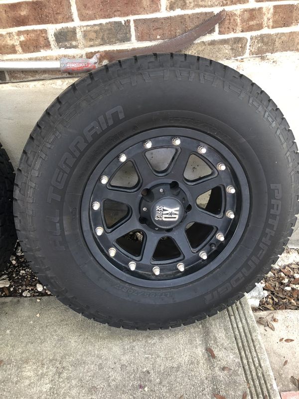 4 All Terrain (AT) pathfinder tires (285/70/17) with 17in XD series