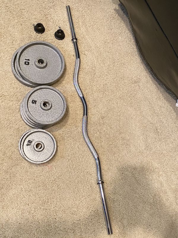 Standard Curl bar with weights and clamps for Sale in Irvine, CA OfferUp