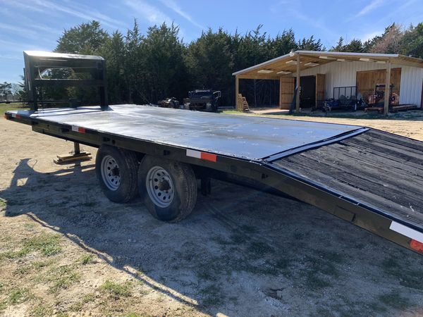 30 ft flatbed trailer with dovetail and ramps. Steel floor, reg in hand ...