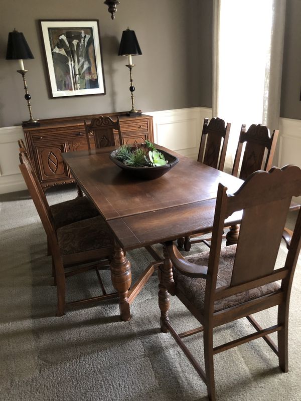 Antique dining set includes table with pull out leaves, 6 chairs and