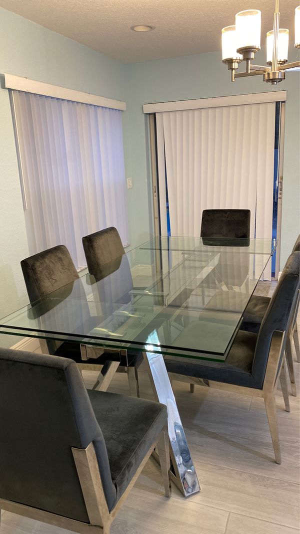 El dorado modern glass dining room table extending. plus 8 chairs