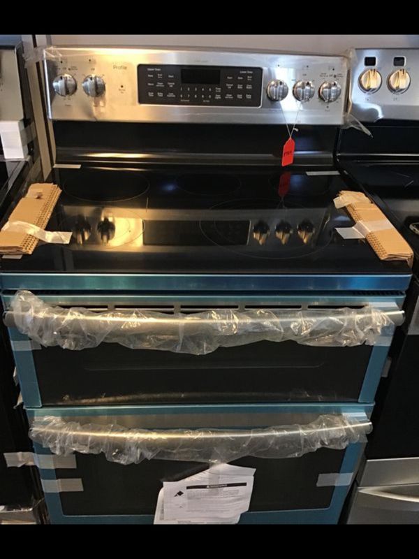 New scratch and dent Ge Profile 5 burner glass top stove double oven. 1