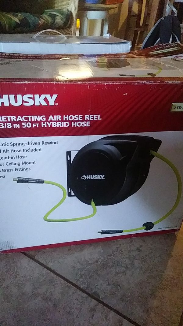 Husky self retracting air.hose reel with 3/8 in 50ft .hybrid hose for