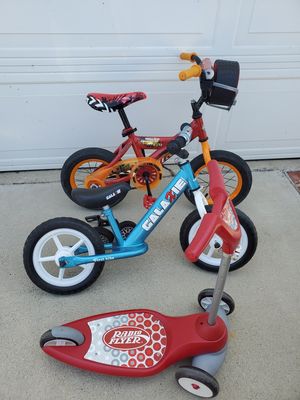 Huffy 12 inch lightning mcqueen bike , first bike Galaxie balance , radio flyer scooter package for Sale in Los Angeles, CA