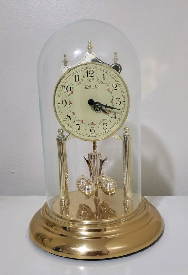 Vintage Gold Anniversary Pendulum clock with a glass dome cover. Made