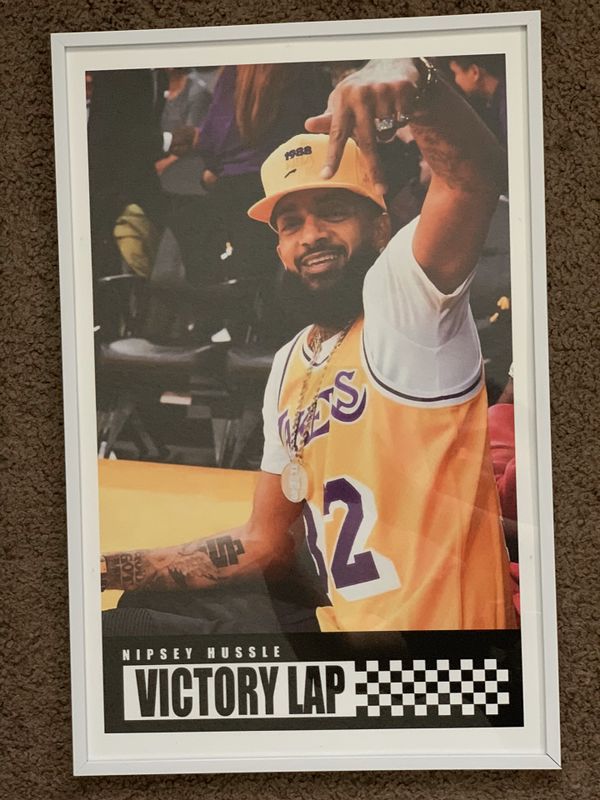 nipsey hussle wearing lakers jersey