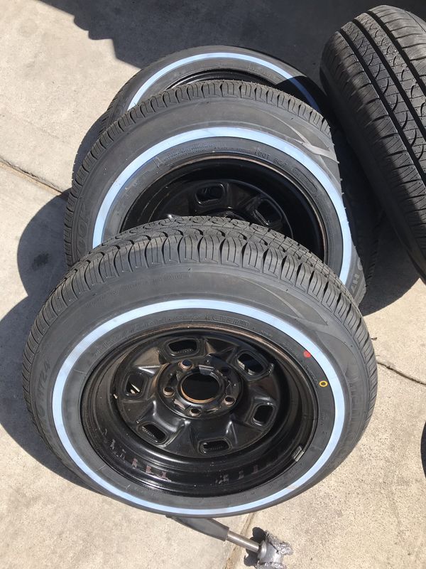 Brand new Hankook 185/75/14 whitewall tires and Chevrolet steel rims