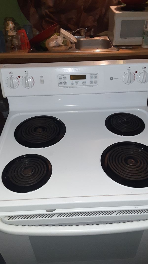 GE Profile true temp electric stove for top burners and brand new oven