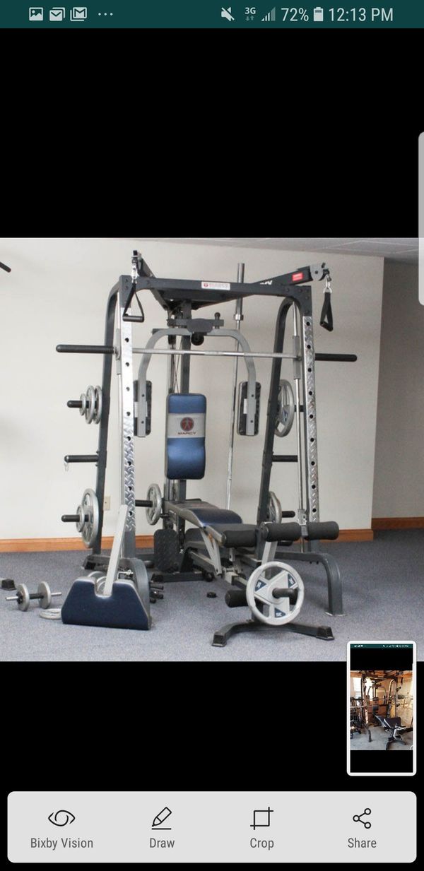 Marcy smiths machine with weight and extra accessories for Sale in