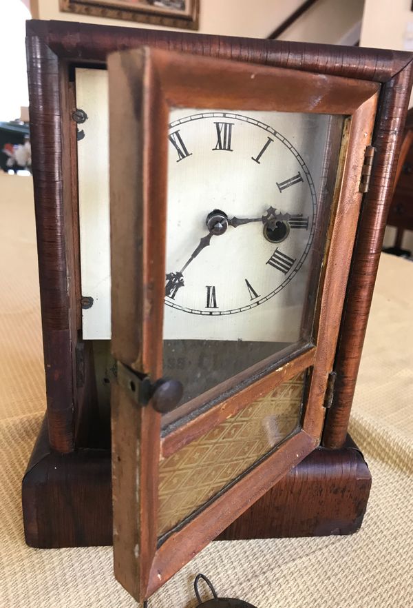 Antique wind up clock by Jerome and company manufactures of eight and
