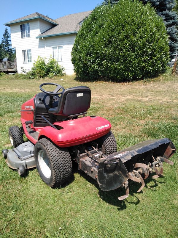 Nice Troy bilt garden tractor/riding mower with tiller attachment for