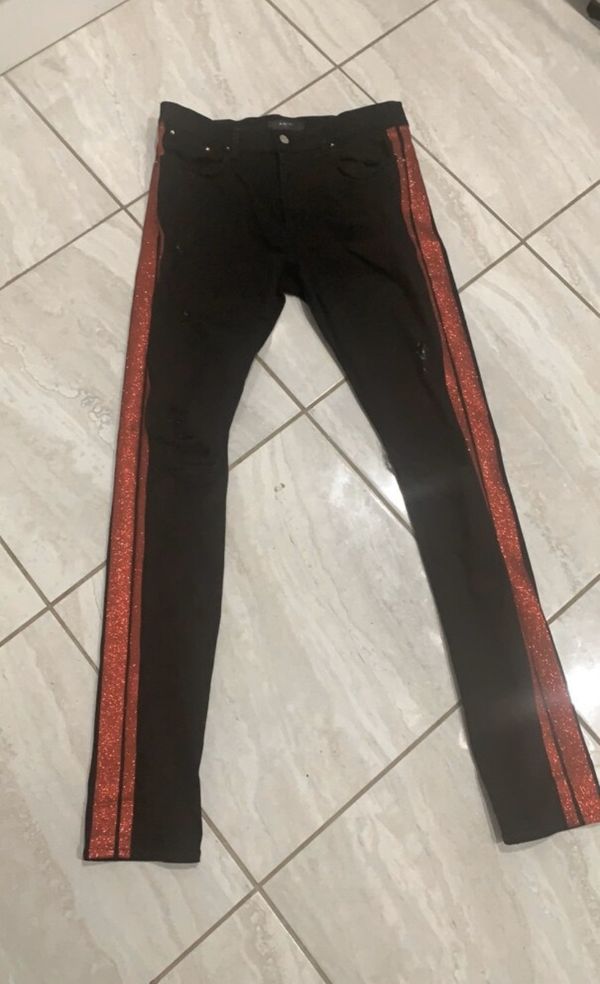 black and orange amiri jeans