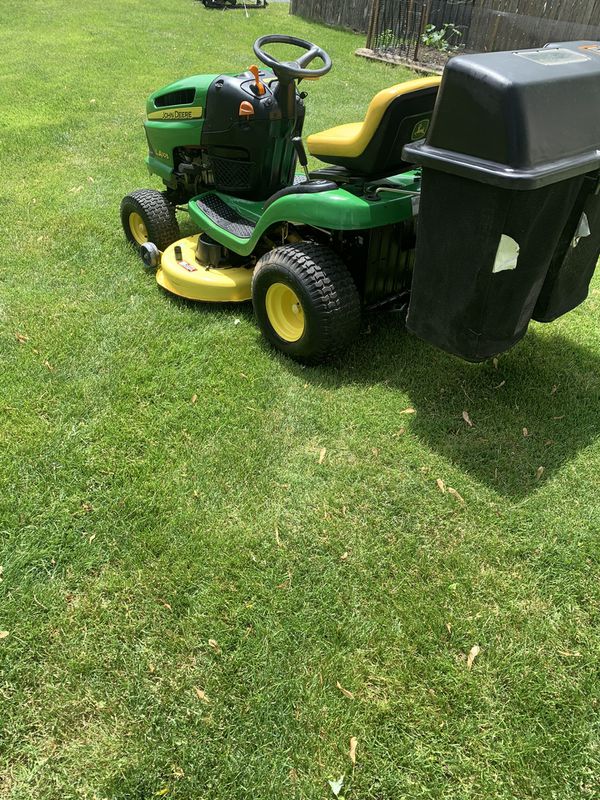Like new John Deere LA105 riding lawn mower with bagger. 67 hours for ...