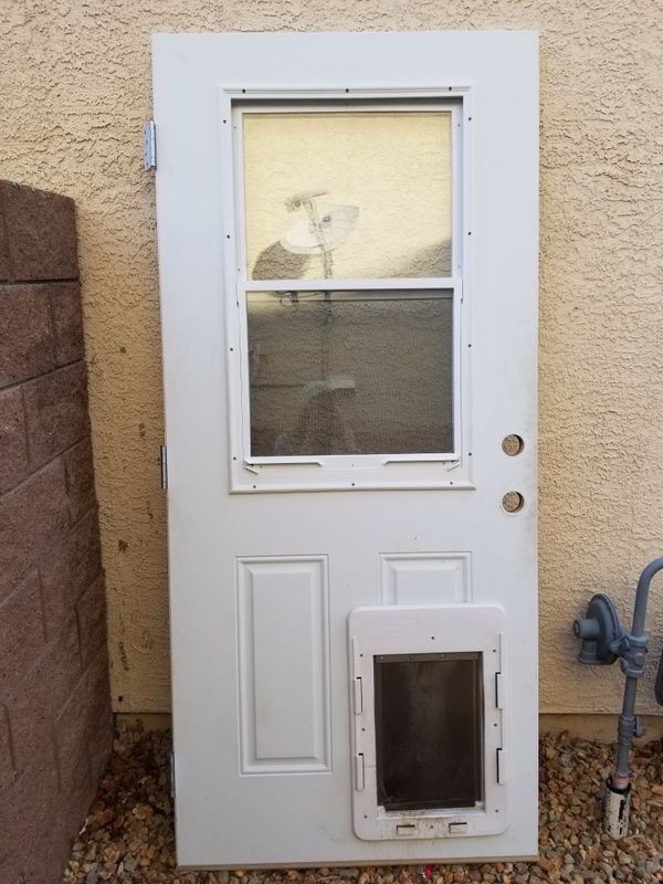 Kitchen/patio door with window and pet door. Lock slider not included