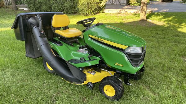 John Deere , riding mower X300 , 42” deck , 100 hours, bagger system ...