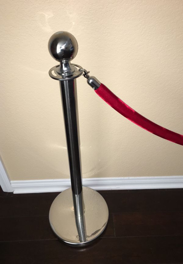 Pair of chrome red carpet poles with one red rope for Sale in Chula