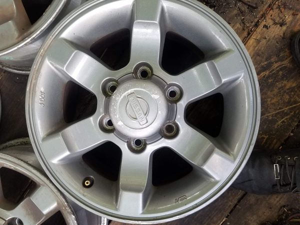 SET OF 4 OEM NISSAN FRONTIER RIMS "15" INCH WHEELS 6 LUG PATTERN. 6 lug