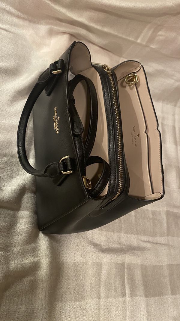 Kate Spade purse Brand new never used The tag is still attach Very beautiful black color a lot ...