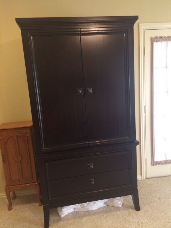 Armoire Ashley's furniture millennium martini suite for Sale in Fort