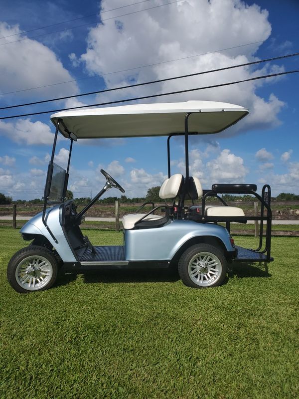 Ezgo golf cart, 4 passenger. Extend roof 12 inch wheels. for Sale in