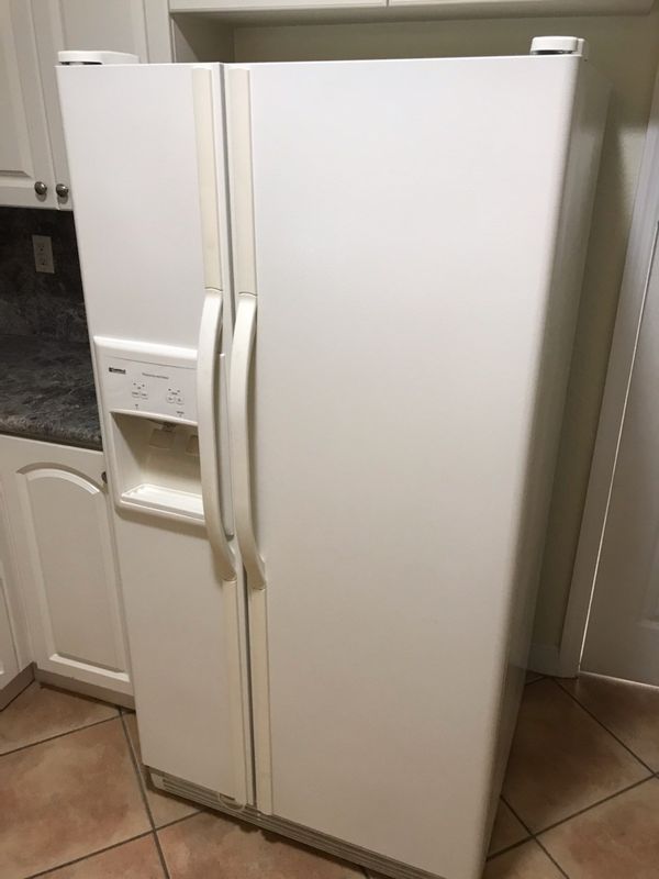 Kenmore Refrigerator double door ice and water works well off white for ...