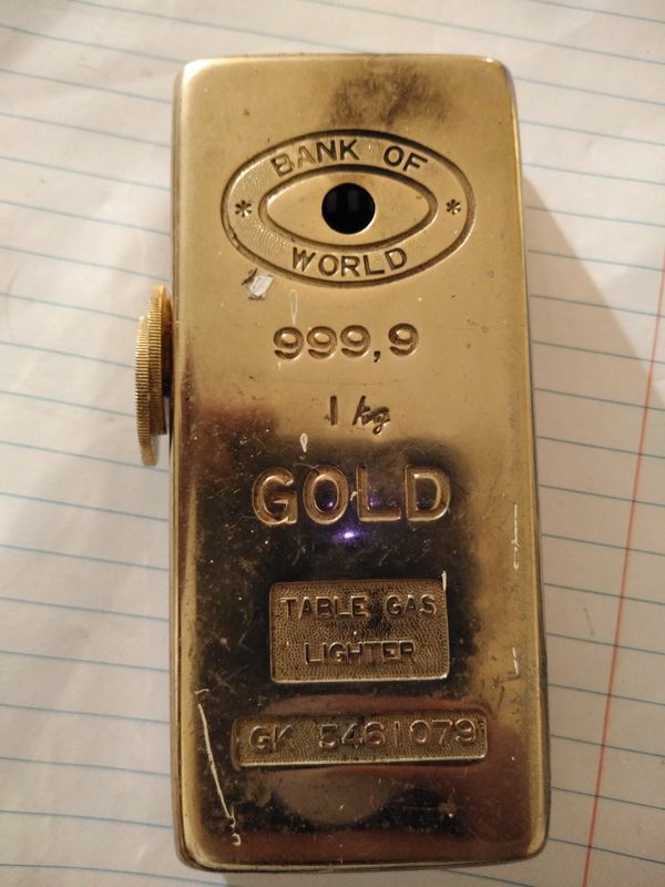 VINTAGE BUTANE CIGARETTE TABLE GAS LIGHTER BANK OF WORLD GOLD BAR 9999