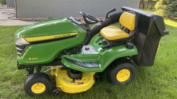 John Deere , riding mower X300 , 42” deck , 100 hours, bagger system ...