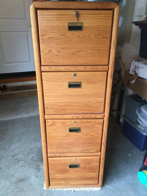 Super nice tall wood filing cabinet for Sale in Bothell ...