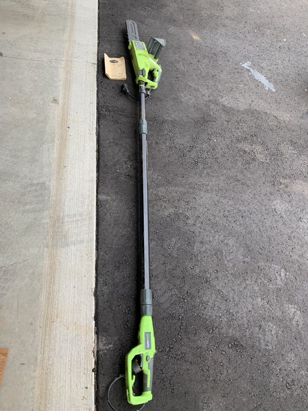 Greenworks electric chain saw with extension pole for Sale in