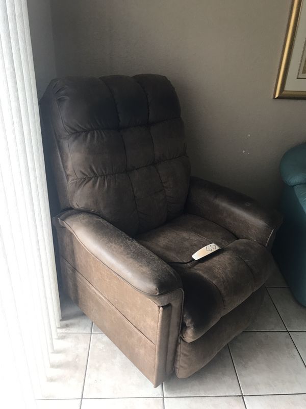 Rooms to Go leather recliner with electric lift assist for Sale in