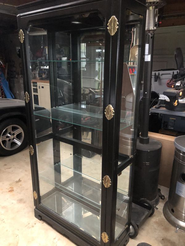 Black Curio 6 ft Tall x 3 ft wide 14 deep. 3 glass shelves 4