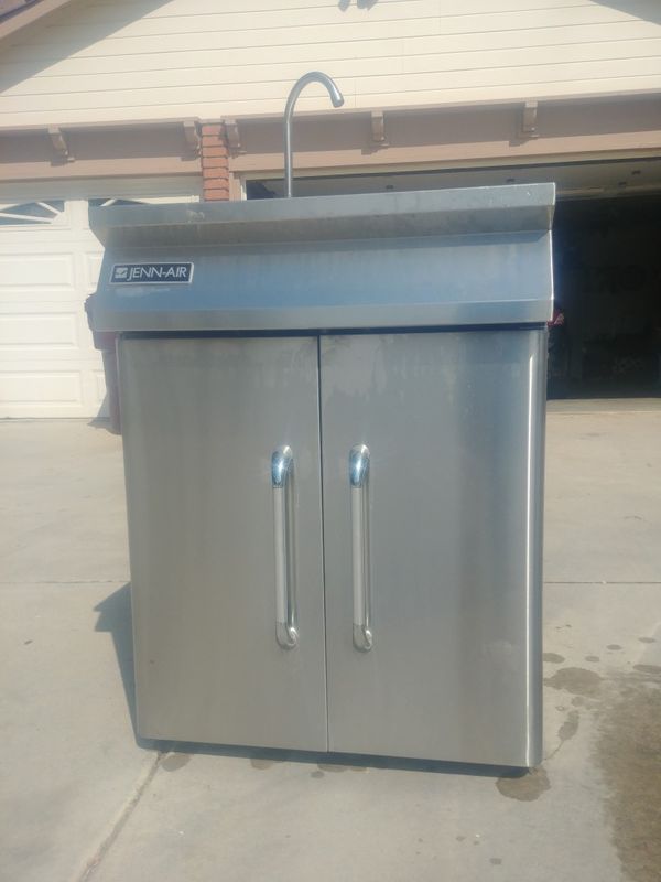 Jenn air out door portable sink with food compartments for Sale in Los