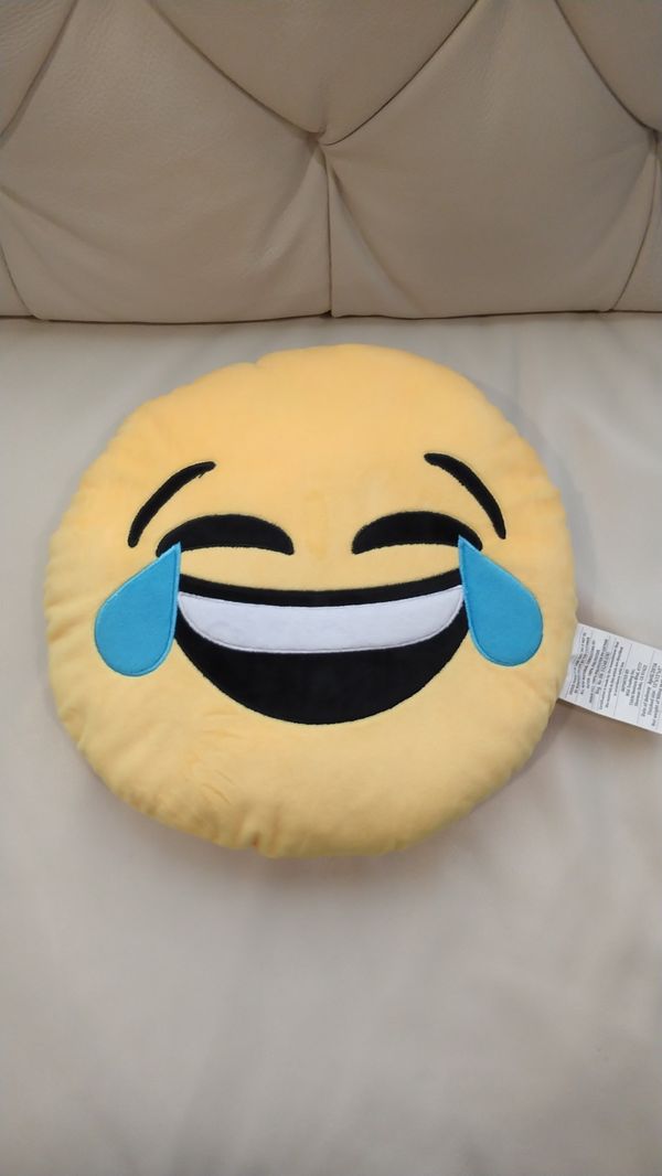 smirking emoji pillow