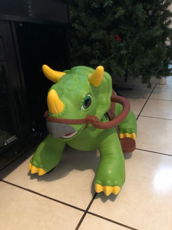 green dinosaur ride on toy