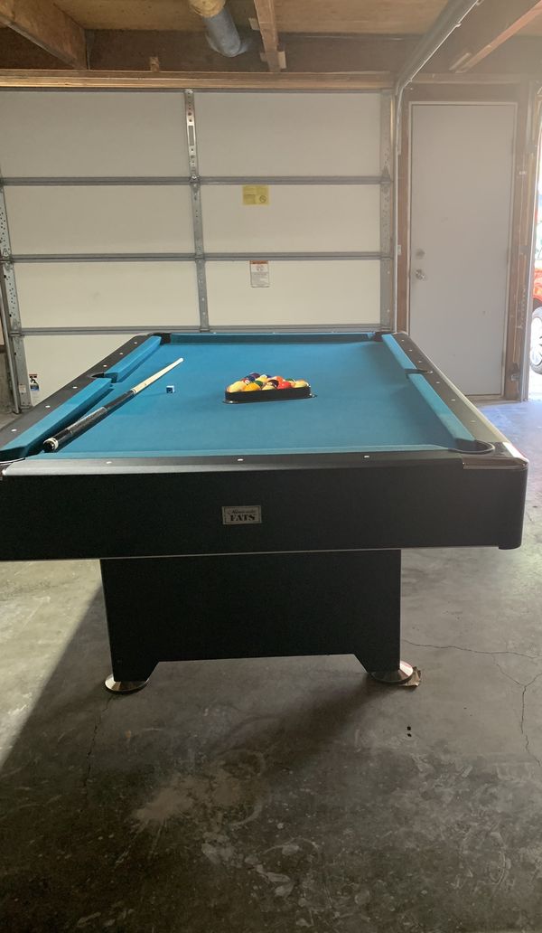 Minnesota Fats pool table. Comes with balls, cues. The size is 96” x 54 ...