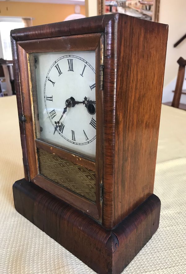 Antique wind up clock by Jerome and company manufactures of eight and
