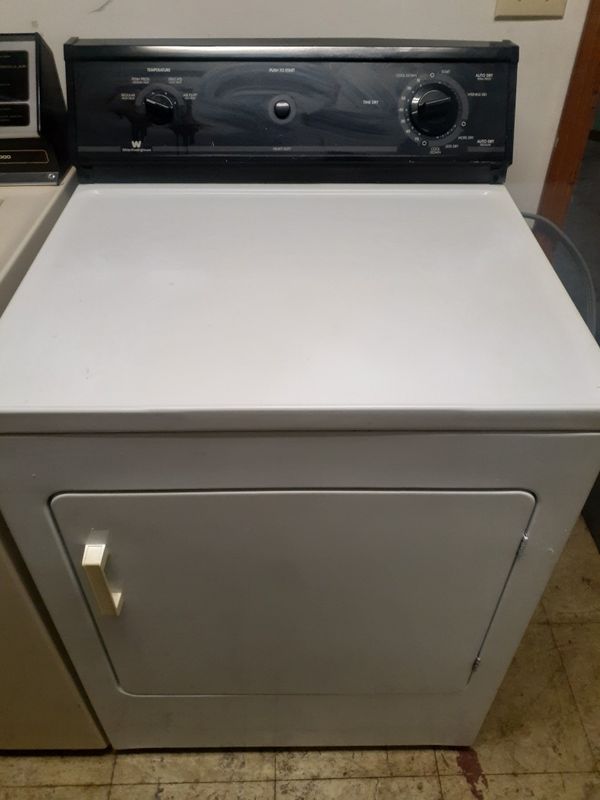 Frigidaire heavy duty super capacity washer and a white Westinghouse