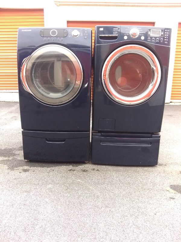 Dark blue front loader washer dryer with pedestal for Sale in Jonesboro