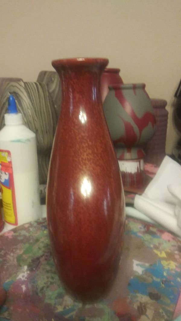 Beautiful rustic odd shaped vase with handle. A rust colored reddish orange vase for Sale in