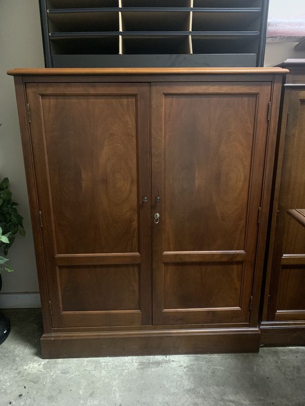 Enclosed bookcase with locking doors. Solid wood cabinet. 39” wide, 15 ...