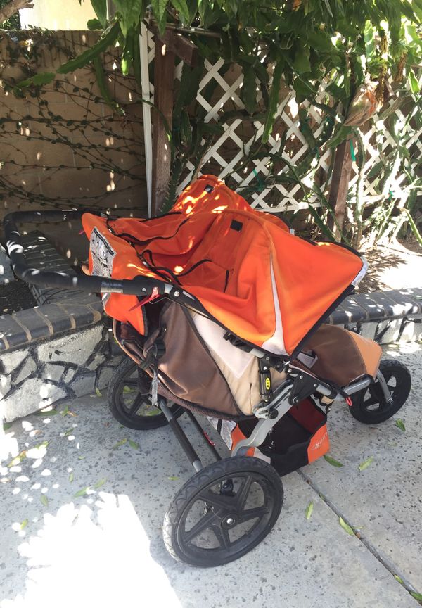 Bob Double Jogging Stroller Orange Good Condition for Sale in Santa Ana