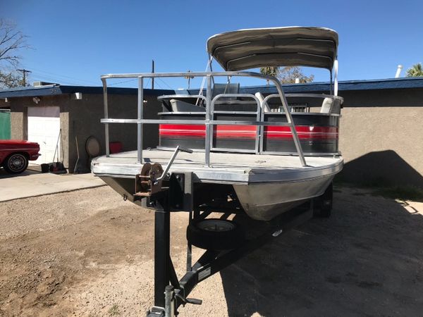 1990 spectrum 24 foot pontoon with 120 hp merc cruiser for