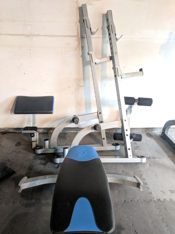 Nautilus Folding Bench Press/Squat Rack, Olympic Bars, and Weights for