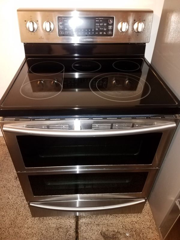 High end stainless steel french 4 door refrigerador and double oven