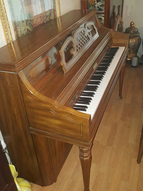 1980 Kimball upright piano; with music books model artist