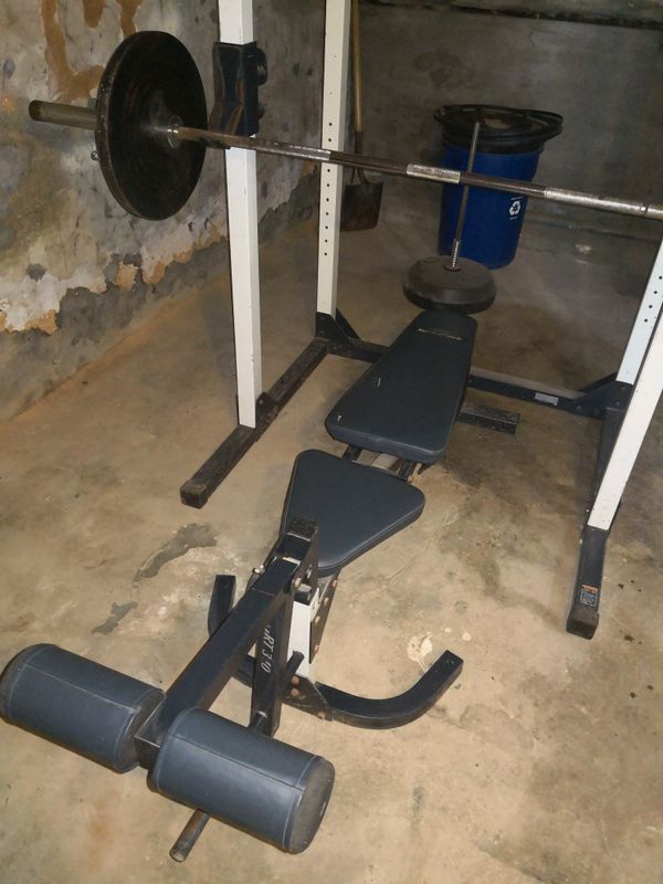 Adjustable Full bench press set, Olympic bar, and weights for Sale in